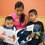 Parenting Classes Latina Mom Reads to Boys